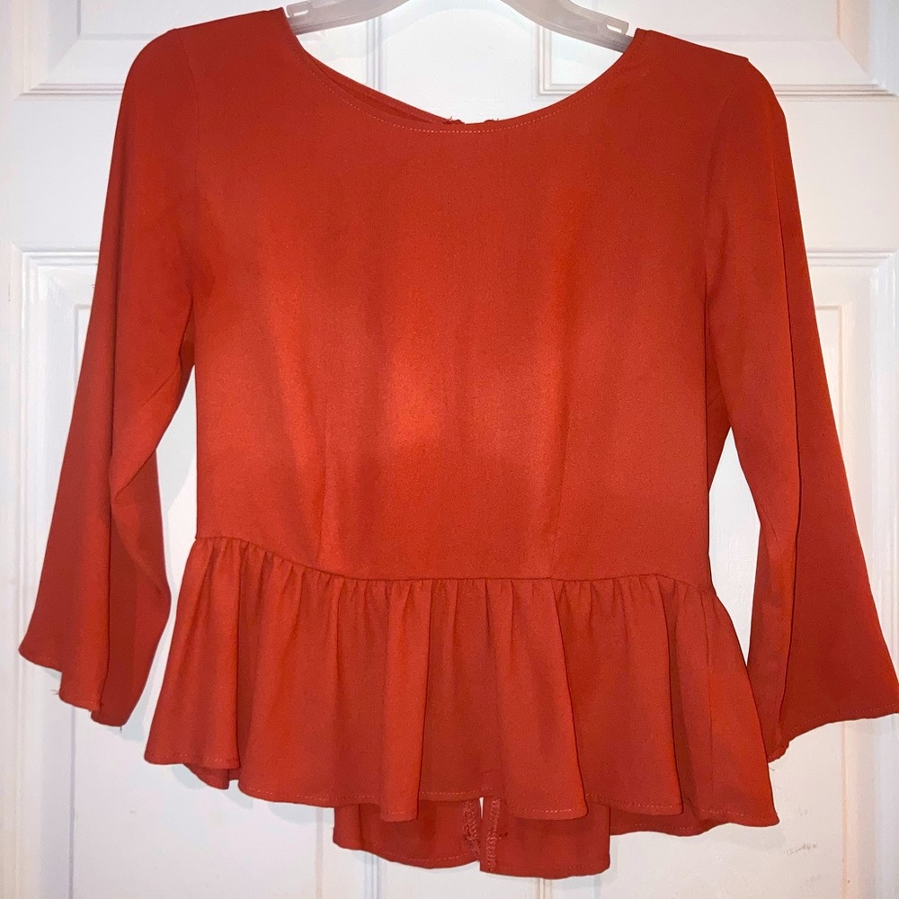 Orange Peplum Long Sleeve Zip up Blouse.